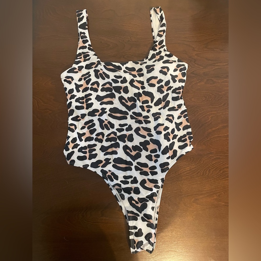 Cheetah one piece, size large, never worn before